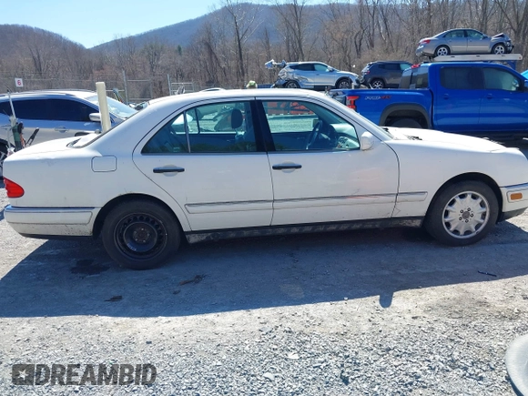 1999 Mercedes-Benz E-Class with VIN WDBJF82H4XX025925, listed as a IAAI auction lot 41839398 with 238,583 mi miles. Bid and sale history available at carsss.com. Image 13.