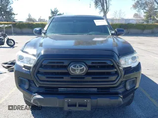 2018 Toyota Tacoma SR with VIN 3TMCZ5AN2JM127244, listed as a IAAI auction lot 41698199 with 61,535 mi miles and . Bid and sale history available at DreamBid. Image 12.