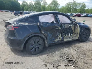 2024 Tesla Model Y Long Range with VIN 7SAYGDEE7RA327259, listed as a Copart auction lot 57494435 with Not provided miles and Salvage title. Bid and sale history available at DreamBid. Image 3.
