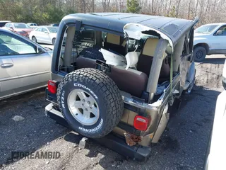 2004 Jeep Wrangler Sahara with VIN 1J4FA59S14P772264, listed as a IAAI auction lot 41814074 with 165,750 mi miles and . Bid and sale history available at DreamBid. Image 4.