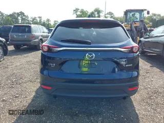 2021 Mazda CX-9 Touring with VIN JM3TCBCY7M0507699, listed as a IAAI auction lot 42603614 with 62,635 mi miles and . Bid and sale history available at DreamBid. Image 16.