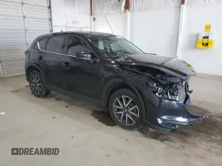 2018 Mazda CX-5 Grand Touring with VIN JM3KFBDM4J0412835, listed as a Copart auction lot 55441315 with 191,968 mi miles and Salvage title. Bid and sale history available at DreamBid. Image 4.