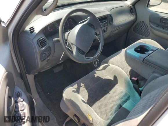 2001 Ford F-150 XLT with VIN 1FTRW07651KC49772, listed as a Copart auction lot 59904815 with 145,639 mi miles and Salvage title. Bid and sale history available at DreamBid. Image 8.