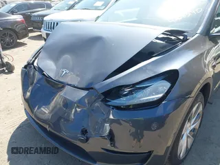 2024 Tesla Model Y Long Range with VIN 7SAYGDEE6RA225161, listed as a IAAI auction lot 42083140 with 28,289 mi miles and . Bid and sale history available at DreamBid. Image 6.