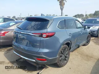 2021 Mazda CX-9 Carbon Edition z VIN JM3TCBDY0M0526352, wystawiony jako IAAI lot #42403901 z przebiegiem 50 193 mil mil oraz . Historia ofert i sprzedaży dostępna na DreamBid. Obrazek 4.