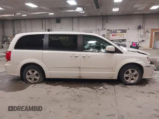 2012 Dodge Grand Caravan SXT with VIN 2C4RDGCG3CR405373, listed as a IAAI auction lot 41264407 with 164,019 mi miles and . Bid and sale history available at DreamBid. Image 14.