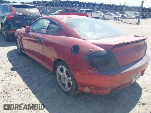 2006 Hyundai Tiburon GT z VIN KMHHN65F86U188431, wystawiony jako IAAI lot #41808475 z przebiegiem 208 879 mil mil oraz . Historia ofert i sprzedaży dostępna na DreamBid. Obrazek 3.