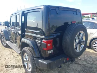 2021 Jeep Wrangler Unlimited Sahara with VIN 1C4HJXEG3MW536507, listed as a IAAI auction lot 41601893 with 51,214 mi miles and . Bid and sale history available at DreamBid. Image 3.