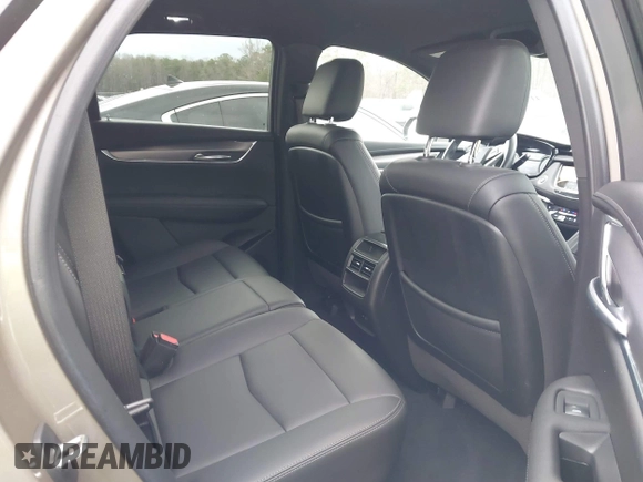 2023 Cadillac XT5 FWD Luxury z VIN 1GYKNAR45PZ140440, wystawiony jako IAAI lot #41723317 z przebiegiem 25 124 mil mil oraz . Historia ofert i sprzedaży dostępna na DreamBid. Obrazek 8.