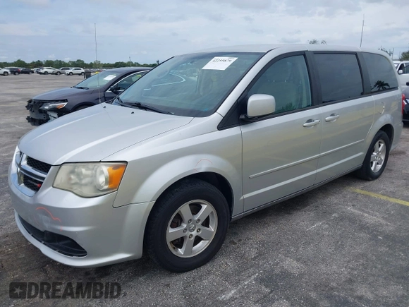 2012 Dodge Grand Caravan SXT with VIN 2C4RDGCG3CR308173, listed as a IAAI auction lot 42255879 with 96,489 mi miles and . Bid and sale history available at DreamBid. Image 2.