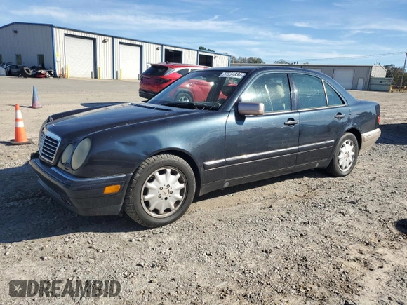1998 Mercedes-Benz E 320 with VIN WDBJF25F3WA578364, listed as a Copart auction lot 77551834 with 228,913 mi miles and Salvage Title. Bid and sale history available at DreamBid. Image 1.