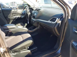 2015 Dodge Journey SE z VIN 3C4PDCAB5FT739266, wystawiony jako IAAI lot #41725086 z przebiegiem 134 109 mil mil oraz . Historia ofert i sprzedaży dostępna na DreamBid. Obrazek 5.