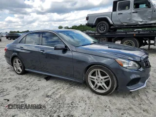 2014 Mercedes-Benz E 350 Sport with VIN WDDHF5KB9EA825975, listed as a Copart auction lot 55427505 with 134,668 mi miles and Salvage title. Bid and sale history available at DreamBid. Image 4.