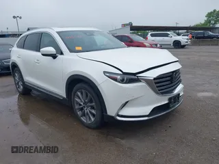 2020 Mazda CX-9 Grand Touring with VIN JM3TCADY8L0415797, listed as a IAAI auction lot 42151449 with 71,162 mi miles and . Bid and sale history available at DreamBid. Image 1.