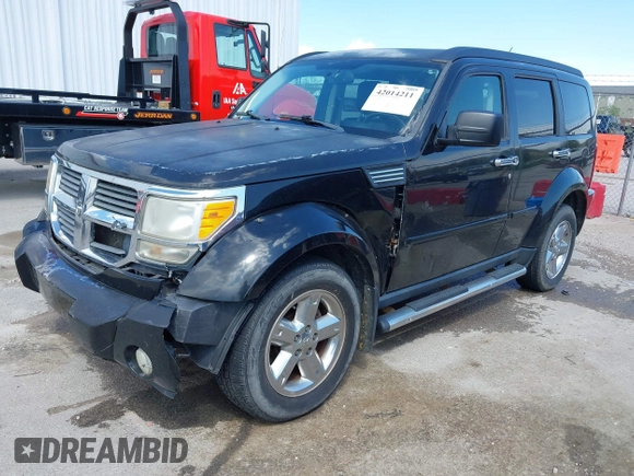 2007 Dodge Nitro SLT with VIN 1D8GU58K97W679278, listed as a IAAI auction lot 42014211 with 213,451 mi miles and . Bid and sale history available at carsss.com. Image 2.