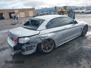 2015 BMW 4 Series 428i with VIN WBA3V7C50FP772915, listed as a IAAI auction lot 41526014 with 116,800 mi miles. Bid and sale history available at carsss.com. Image 4.