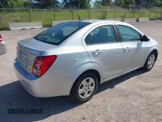 2013 Chevrolet Sonic LS with VIN 1G1JA5SH1D4246936, listed as a IAAI auction lot 42665664 with 124,464 mi miles and . Bid and sale history available at DreamBid. Image 4.