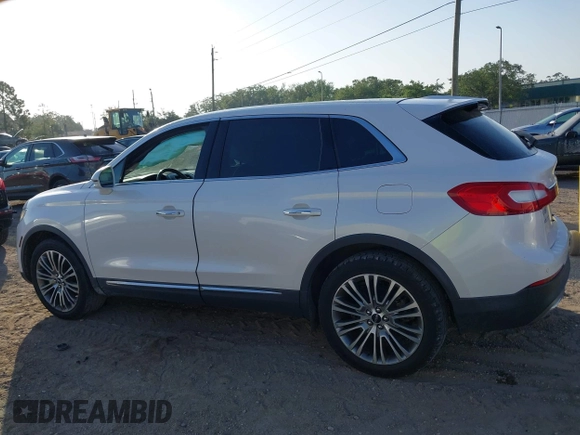 2016 Lincoln MKX Reserve with VIN 2LMTJ6LR4GBL75275, listed as a IAAI auction lot 41936550 with 76,177 mi miles. Bid and sale history available at carsss.com. Image 14.