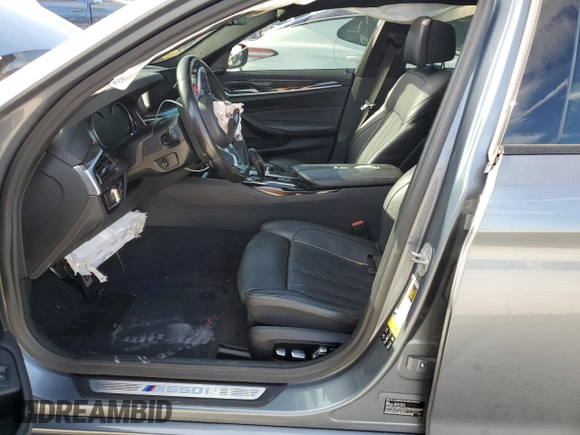 2018 BMW 5 Series M550i xDrive with VIN WBAJB9C53JB034947, listed as a Copart auction lot 77270534 with Not provided miles and Non repairable. Bid and sale history available at DreamBid. Image 7.