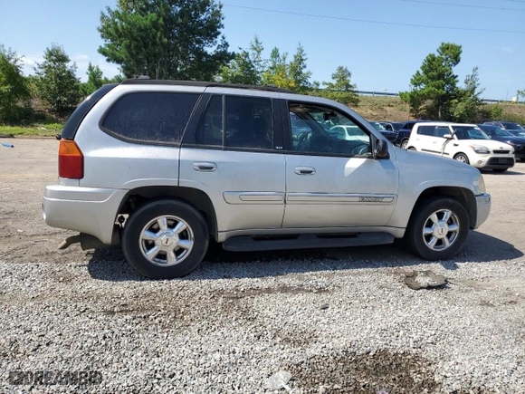 2004 GMC Envoy SLT with VIN 1GKDS13S942193519, listed as a Copart auction lot 84952984 with 156,599 mi miles and Salvage Title. Bid and sale history available at carsss.com. Image 3.