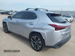 2023 Lexus UX 250h Premium z VIN JTHP6JBH5P2145912, wystawiony jako IAAI lot #42401353 z przebiegiem 14 252 mil mil oraz . Historia ofert i sprzedaży dostępna na DreamBid. Obrazek 3.