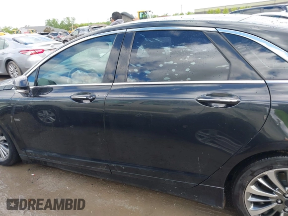 2015 Lincoln MKZ z VIN 3LN6L2G99FR625258, wystawiony jako IAAI lot #42308188 z przebiegiem 186 911 mil mil oraz . Historia ofert i sprzedaży dostępna na DreamBid. Obrazek 14.