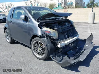 2012 Scion iQ with VIN JTNJJXB07CJ017296, listed as a IAAI auction lot 41636769 with 94,333 mi miles. Bid and sale history available at carsss.com. Image 1.