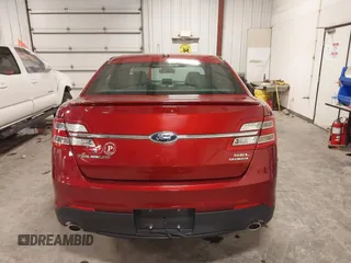 2014 Ford Taurus SEL z VIN 1FAHP2E83EG137639, wystawiony jako IAAI lot #41535259 z przebiegiem 62 978 mil mil oraz . Historia ofert i sprzedaży dostępna na DreamBid. Obrazek 16.