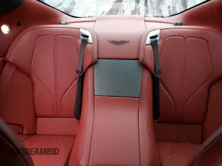 2015 Aston Martin DB9 z VIN SCFFDAEM9FGA16279, wystawiony jako Copart lot #81886554 z przebiegiem 25 029 mil mil oraz Szkody całkowita. Historia ofert i sprzedaży dostępna na DreamBid. Obrazek 10.