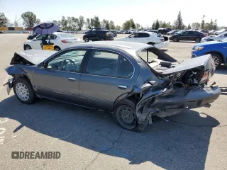 1999 Nissan Maxima GXE z VIN JN1CA21D9XM409448, wystawiony jako Copart lot #51822895 z przebiegiem Nie podano mil oraz Szkoda całkowita • Salvage title. Historia ofert i sprzedaży dostępna na DreamBid. Obrazek 2.