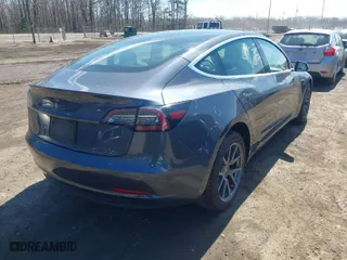2020 Tesla Model 3 Standard Range Plus with VIN 5YJ3E1EA2LF634566, listed as a IAAI auction lot 41880994 with 65,395 mi miles. Bid and sale history available at carsss.com. Image 4.