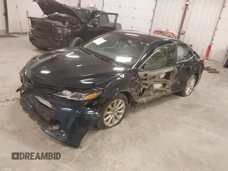 2020 Toyota Camry LE with VIN 4T1C11AK5LU926564, listed as a IAAI auction lot 41864812 with 104,212 mi miles and . Bid and sale history available at carsss.com. Image 2.