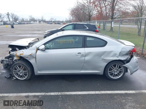 2005 Scion tC with VIN JTKDE177150001329, listed as a IAAI auction lot 41952901 with 143,223 mi miles. Bid and sale history available at carsss.com. Image 14.