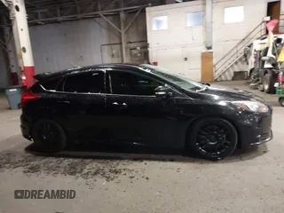 2014 Ford Focus ST with VIN 1FADP3L96EL355713, listed as a IAAI auction lot 41572939 with 102,838 mi miles and . Bid and sale history available at carsss.com. Image 14.