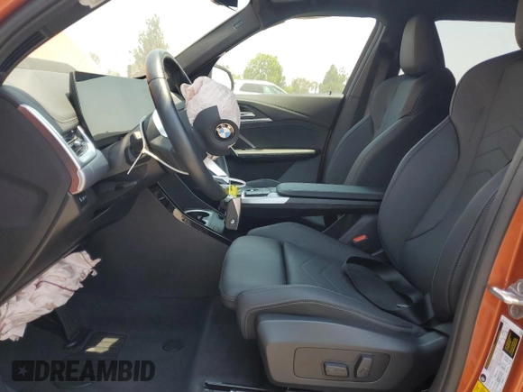 2023 BMW X1 xDrive28i with VIN WBX73EF03P5W54209, listed as a Copart auction lot 64796365 with 19,591 mi miles and Salvage title. Bid and sale history available at DreamBid. Image 7.