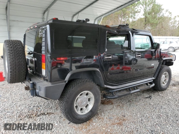 2003 Hummer H2 with VIN 5GRGN23U33H118459, listed as a Copart auction lot 77765694 with 157,390 mi miles and Salvage Title. Bid and sale history available at carsss.com. Image 3.