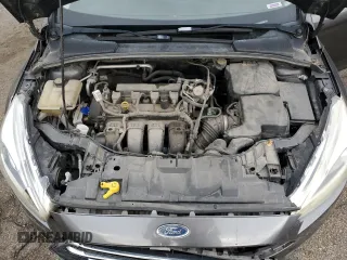 2016 Ford Focus Titanium z VIN 1FADP3N27GL329026, wystawiony jako Copart lot #60910475 z przebiegiem 98 794 mil mil oraz Szkoda całkowita • Salvage title. Historia ofert i sprzedaży dostępna na DreamBid. Obrazek 11.