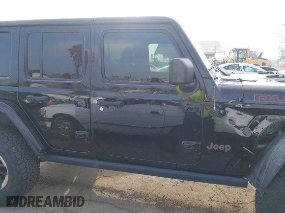 2020 Jeep Wrangler Unlimited Rubicon with VIN 1C4HJXFG1LW141335, listed as a IAAI auction lot 42724973 with 59,843 mi miles and . Bid and sale history available at DreamBid. Image 13.