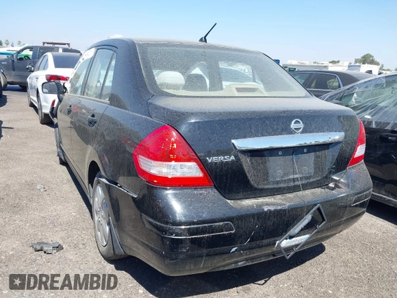 2009 Nissan Versa S with VIN 3N1BC11E19L440957, listed as a IAAI auction lot 40039437 with Not Provided miles and . Bid and sale history available at DreamBid. Image 3.