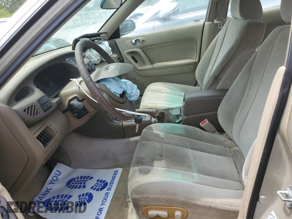 2000 Mazda Millenia with VIN JM1TA2210Y1614967, listed as a Copart auction lot 53606185 with 120,288 mi miles and Salvage Title. Bid and sale history available at DreamBid. Image 7.