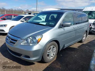 2005 Honda Odyssey EX-L with VIN 5FNRL38765B094377, listed as a IAAI auction lot 41933616 with 213,979 mi miles. Bid and sale history available at carsss.com. Image 2.
