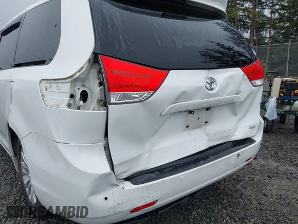 2014 Toyota Sienna XLE with VIN 5TDYK3DC2ES485846, listed as a IAAI auction lot 41693092 with 106,156 mi miles and . Bid and sale history available at DreamBid. Image 6.