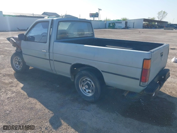 1990 Nissan Trucks 2WD XE with VIN 1N6SD11S4LC400985, listed as a IAAI auction lot 41986390 with 189,924 mi miles. Bid and sale history available at carsss.com. Image 3.