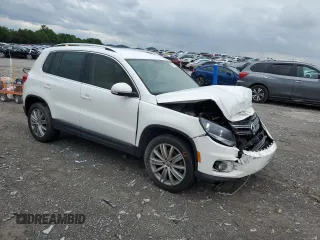 2014 Volkswagen Tiguan SE z VIN WVGAV3AX5EW551477, wystawiony jako Copart lot #55773245 z przebiegiem 153 437 mil mil oraz Czysty tytuł • Clean title. Historia ofert i sprzedaży dostępna na DreamBid. Obrazek 4.