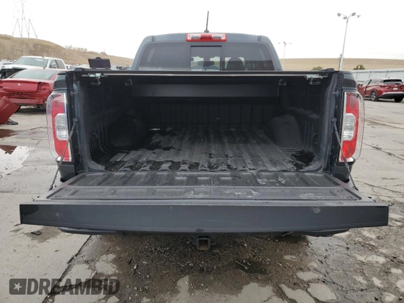 2018 GMC Canyon z VIN 1GTP6CE1XJ1173875, wystawiony jako Copart lot #47258005 z przebiegiem 104 076 mil mil oraz Szkoda całkowita • Salvage title. Historia ofert i sprzedaży dostępna na DreamBid. Obrazek 6.