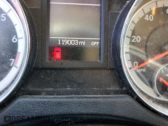 2015 Dodge Grand Caravan SXT with VIN 2C4RDGCG8FR584983, listed as a Copart auction lot 49457795 with 119,003 mi miles and Clean Title. Bid and sale history available at DreamBid. Image 9.