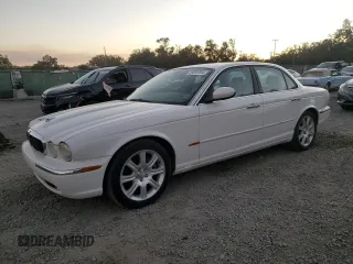 2004 Jaguar XJ with VIN SAJWA71C14SG16264, listed as a Copart auction lot 83251554 with 267,493 mi miles and Salvage Title. Bid and sale history available at carsss.com. Image 1.