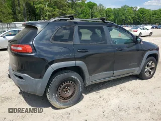 2014 Jeep Cherokee Trailhawk with VIN 1C4PJMBS1EW242527, listed as a Copart auction lot 53160485 with 104,074 mi miles and Salvage Title. Bid and sale history available at carsss.com. Image 3.