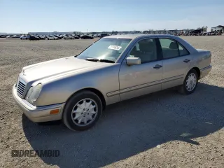 1999 Mercedes-Benz E-Class with VIN WDBJF65H5XA804902, listed as a Copart auction lot 73704634 with 92,411 mi miles and Salvage Title. Bid and sale history available at carsss.com. Image 1.
