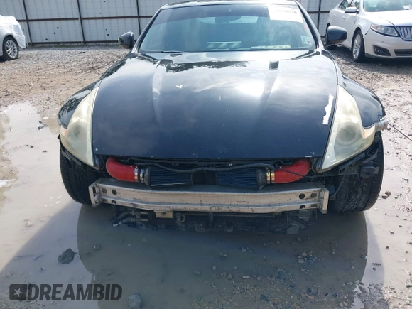 2013 Nissan 370Z with VIN JN1AZ4EH9DM880407, listed as a IAAI auction lot 42078526 with 216,029 mi miles. Bid and sale history available at carsss.com. Image 6.